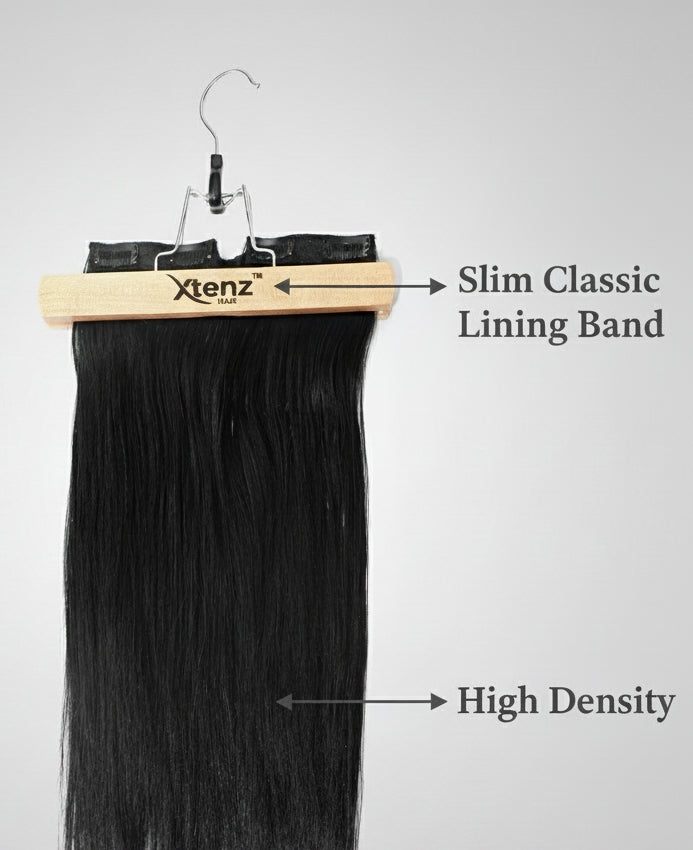 Black hair extensions on a hanger with Xenz branding against a white background